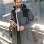 Jennings Brower Instagram - Do you feel the heartbeat of the city? It's bold, vibrant, and always a step ahead: just like our NEW Augment Coat from the Augment Collection! Step into any room with confidence, ready not just to enter it, but command it. . . 🌧️ Waterproof? 100%, yes. 🔥 Fleece-lined? Absolutely. 🎩 Classic Volante design? Always. . . Check it out in the beguiling Blacksword or swipe right for the graceful Gilded Sneaking Suit. Casual or bundled, with four zip pockets for all your essentials, the Augment Coat isn’t setting the fashion standard, it IS the standard. Available now! . . #augmentedwear #mensfashion #menscoat #warmcoat #longcoat #paneldesign