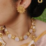 Jisma Jiji Instagram - Pretty pastels & the shimmer of gold. Meenakari work in pastel pink gives a beautiful aura to these pieces from @lakshmijewellery916. Perfect to add that aura of elegance to your look, @lakshmijewellery916 has the best collection of meenakari ornaments ! Visit @lakshmijewellery916 today, to get your hands on their latest collection of designer jewellery ! Costume courtesy: @parishkaari_official