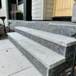 John Colaneri Instagram - #Design is all in the details and the stone work that we did around our home created a major change. When looking to update the exterior of your home always add different textures and materials. This will allow those elements to play off of each other. The earth tones from the new @jameshardie siding and the black granite from @polycor_hardscapes are two materials that work very well together. #curbappeal #exteriordesign #stoneveneer #stonework #designgoals #designinspiration #njdesigner #njbuilders