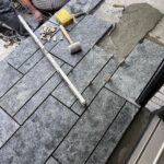 John Colaneri Instagram - #Design is all in the details and the stone work that we did around our home created a major change. When looking to update the exterior of your home always add different textures and materials. This will allow those elements to play off of each other. The earth tones from the new @jameshardie siding and the black granite from @polycor_hardscapes are two materials that work very well together. #curbappeal #exteriordesign #stoneveneer #stonework #designgoals #designinspiration #njdesigner #njbuilders