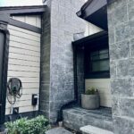 John Colaneri Instagram - #Design is all in the details and the stone work that we did around our home created a major change. When looking to update the exterior of your home always add different textures and materials. This will allow those elements to play off of each other. The earth tones from the new @jameshardie siding and the black granite from @polycor_hardscapes are two materials that work very well together. #curbappeal #exteriordesign #stoneveneer #stonework #designgoals #designinspiration #njdesigner #njbuilders
