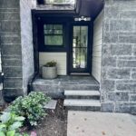 John Colaneri Instagram - #Design is all in the details and the stone work that we did around our home created a major change. When looking to update the exterior of your home always add different textures and materials. This will allow those elements to play off of each other. The earth tones from the new @jameshardie siding and the black granite from @polycor_hardscapes are two materials that work very well together. #curbappeal #exteriordesign #stoneveneer #stonework #designgoals #designinspiration #njdesigner #njbuilders