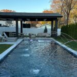 John Colaneri Instagram - My clients pool and backyard patio are complete! The countertop by @sapienstone_usa fabricated by @faithfulcountertops was installed today and it looks incredible! I love the entire vibe of the space and I know come next summer this space is going to get a lot of use. Great work by @aquaticpoolmanagement on getting the pool installed! Let’s do another! Onto the next project! #backyard #backyardgoals #backyardoasis #design #designgoals #designinspiration #njdesigner #njbuilders