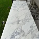 John Colaneri Instagram - The bar area is complete with @sapienstone_usa counter in Arabescato. The bar is by @urbanbonfire in Onyx with black handles. The beauty of these materials is that there is zero maintenance! The counter is porcelain and the bar is made of marine grade aluminum that is powder coated. Thank you to my incredible installers @faithfulcountertops and @distinctively_outdoors. #design #designinspiration #designgoals #outdoorkitchen #outdoorliving #outdoordecoration New Jersey