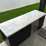 John Colaneri Instagram - The bar area is complete with @sapienstone_usa counter in Arabescato. The bar is by @urbanbonfire in Onyx with black handles. The beauty of these materials is that there is zero maintenance! The counter is porcelain and the bar is made of marine grade aluminum that is powder coated. Thank you to my incredible installers @faithfulcountertops and @distinctively_outdoors. #design #designinspiration #designgoals #outdoorkitchen #outdoorliving #outdoordecoration New Jersey