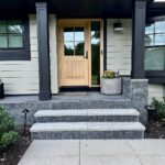 John Colaneri Instagram - #Design is all in the details and the stone work that we did around our home created a major change. When looking to update the exterior of your home always add different textures and materials. This will allow those elements to play off of each other. The earth tones from the new @jameshardie siding and the black granite from @polycor_hardscapes are two materials that work very well together. #curbappeal #exteriordesign #stoneveneer #stonework #designgoals #designinspiration #njdesigner #njbuilders