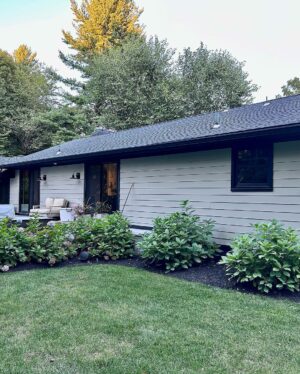 John Colaneri Instagram - A little after and before in the rear of our home. It has gone through some massive transformations over the past couple of years. I have not shared any pictures of the rear complete yet.  With the new @jameshardie siding and patio by @polycor_hardscapes it is a great place to entertain and just relax. We now have around 2,000 sq ft of patio space which makes a huge difference to the property.  With summer ending the fall is my favorite season by far and I cannot wait to sit around the fire 🔥 pit.

@woodhavenlumber @northernvalleystone 

#design #designinspiration #curbappeal #exteriordesign #exteriordecor #designgoals #njdesigner