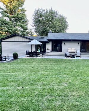 John Colaneri Instagram - A little after and before in the rear of our home. It has gone through some massive transformations over the past couple of years. I have not shared any pictures of the rear complete yet.  With the new @jameshardie siding and patio by @polycor_hardscapes it is a great place to entertain and just relax. We now have around 2,000 sq ft of patio space which makes a huge difference to the property.  With summer ending the fall is my favorite season by far and I cannot wait to sit around the fire 🔥 pit.

@woodhavenlumber @northernvalleystone 

#design #designinspiration #curbappeal #exteriordesign #exteriordecor #designgoals #njdesigner
