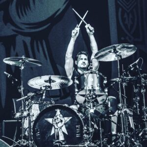 John Dolmayan Instagram - I remember right around the time system was getting signed to a record deal we were afforded the opportunity to see @rageagainstthemachine live . We got our first back stage passes and laminates and were allowed to watch from the side of the stage and even met the band . What an amazing experience! @bradwilk is an excellent drummer and has been an integral part of every band he’s played with including the album he did with Black Sabbath. On top of that he’s a genuine and sweet human being and loves classic muscle cars( pretty cool ) . I’d like to thank him for his positive influence and for always being such a welcoming and nice guy ! Rage kicks ass and Brads a big part of why they do !