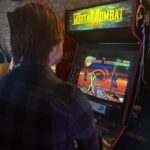 Jon Lajoie Instagram - Love this album art by @fredheidbrink for the Wolfie’s Just Fine song “Mortal Kombat 2.” Check my previous post for the full video. p.s. This is me playing MK2 at @logan_arcade in Chicago last month. The machine there is in flawless condition. So fun.