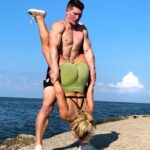 Julian Daigre Instagram - Which partner exercise are you willing to try with your gym bestie? 🤔 1. Superman Swings 2. Clean. Jerk. Squat. Repeat. 3. Cirque Du Sore Legs 4. Machine Gun Aby Send this to someone you’d try with & let us know in comments and if you have any questions of how to get in to and out of these exercises! ⛽️ @reignbodyfuel #reignbodyfuel