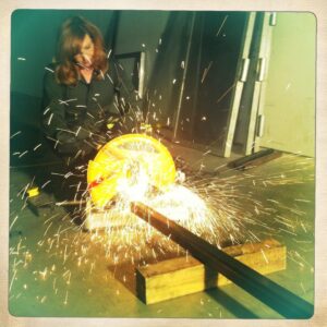 Kari Byron Instagram - Sparks burn. Why are women makers always dressed up like a princess and then given a grinder for a photoshoot? I have posed for that shot so many times. In real life I wouldn’t be in a shop in a dress unless it was under my coveralls.