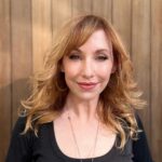 Kari Byron Instagram - I just figured out the color of my hair is redwood. I blend into this background.