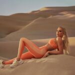 Khloé Kardashian Instagram - Name a better duo. The Principal Low Impact Bra and Motion365+ High Waisted Bungee Legging in St. Tropez Coral are everything 🍑 #Fableticspartner #FableticsxKhloé