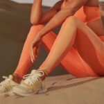 Khloé Kardashian Instagram - Name a better duo. The Principal Low Impact Bra and Motion365+ High Waisted Bungee Legging in St. Tropez Coral are everything 🍑 #Fableticspartner #FableticsxKhloé