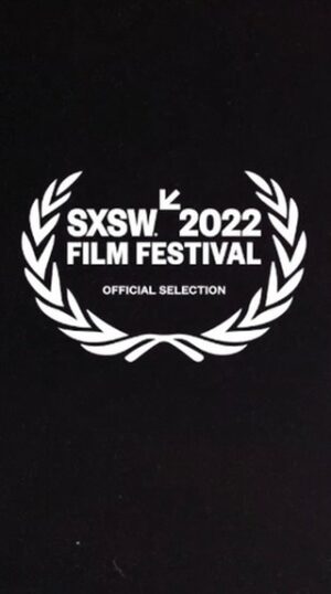 Kiera Allen Instagram - SXSW is kicking off this week…. and our film is going to be there!! So excited to show you guys the trailer and poster for @asheakin’s wonderful film Roommates, starring @kelseeeyj and me. I adore these women, had such a blast working with the whole team, and can’t wait for the world to see what we made together. And please do let me know if I should make blue hair a permanent look

Credits (nabbed from Ashley’s post):
Written by: Ashley Eakin @asheakin + Kelsey Johnson @kelseeeyj
Starring: Kiera Allen + Kelsey Johnson, Harrison Cone, Nicholas Duvernay
Exec Producers: Paul Feig, Laura Fischer, Kesila Childers, Erica Fishman, Elle Roth-Brunet
Producer: Josy Odio
Director of Photography: Arlene Muller
Production Design: Laura Santoyo
Costumes: Keyla Marquez
Editor: Shawn Lovering
1st AD: Jasmine Thomas
Cam Op: Koji Kojima
1st Asst Cam: Darrell Ham
2nd Asst Cam: Emily Lien
Stills (and photo by): Shanley Kellis
Script Supervisor: Nicol Miller
Props: Jack Meltzer
Gaffer: Ryan Oppendisano
Key Grip: Adam Schaffer
HMU Dept: Suzette Beautique, Victoria Robinson, Myishia Jackson Barnett
Sound: Scott Kaser + Nial Morgan
Colorist: @rkmstudios_color RyanK. McNeal
Mixer: Marcello Dubaz

#accessibility description: A teaser trailer for a film called Roommates. Two college-age young women meet in a dorm room and discover that they are roommates. One is a wheelchair user (played by @kierajallen) and the other is an amputee (played by @kelseeeyj). After this, there is a montage of the two young women partying, drinking, smoking, and laughing as house music plays in the background. At the end, a white logo appears against a black background, reading “SXSW 2022 Film Festival Official Selection.”