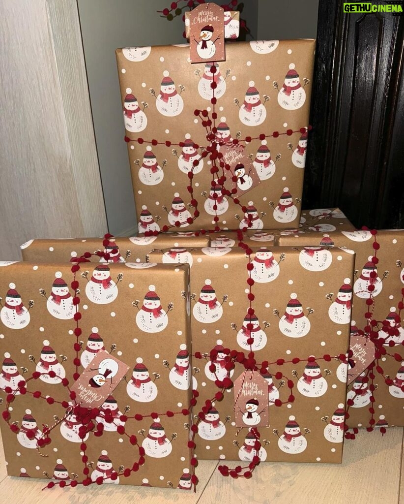 Kim Kardashian Instagram - Wrapping gifts in our family is always such a fun family tradition to see what each family member did and their vibe for the year. Each represents us so well! I did all white SKIMS cotton jersey t shirt fabric. I’m excited to reuse it and make other things. Kylie did a festive Santa print. Kravis a simple green cool wrapping. My mom a shiny metallic red wrapping. Kendall did a chic blue and white print with green bow. Rob wrapped everything in a festive snowman print with a white bin that has these soft ball shape. Khloe did a gorgeous monochromatic green with green ribbon.