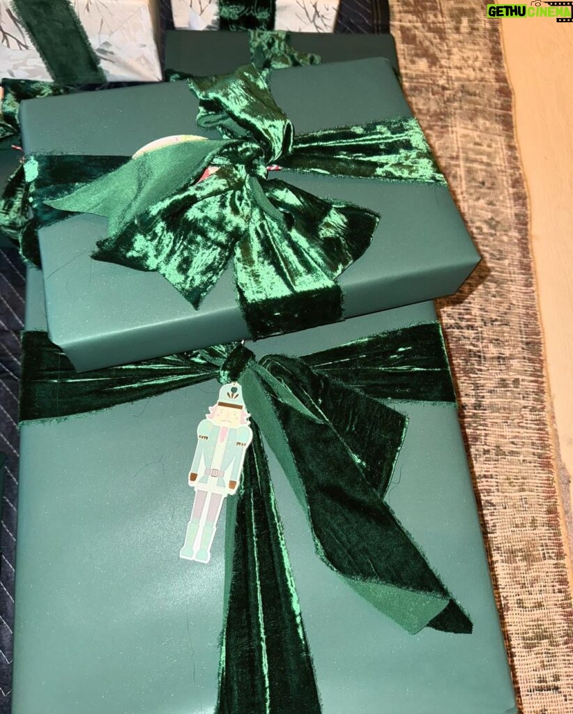 Kim Kardashian Instagram - Wrapping gifts in our family is always such a fun family tradition to see what each family member did and their vibe for the year. Each represents us so well! I did all white SKIMS cotton jersey t shirt fabric. I’m excited to reuse it and make other things. Kylie did a festive Santa print. Kravis a simple green cool wrapping. My mom a shiny metallic red wrapping. Kendall did a chic blue and white print with green bow. Rob wrapped everything in a festive snowman print with a white bin that has these soft ball shape. Khloe did a gorgeous monochromatic green with green ribbon.