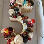 Kristen Schaal Instagram - My Ruby turned 5 and I got this gorgeous cake from @crumbles__patisserie! Thank you! They make fun cakes in Encino and they let us add Ruby’s favorite SpiderMan characters to take a much needed break fighting bad guys to celebrate. Happy birthday to Ruby!