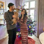 Lily Collins Instagram - The process of getting our holiday photo involves lots of @redforddog kisses (plus a cute cozy sweater) and we’re not complaining. Merry Christmas, everyone! From our lil family to yours…