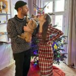 Lily Collins Instagram - The process of getting our holiday photo involves lots of @redforddog kisses (plus a cute cozy sweater) and we’re not complaining. Merry Christmas, everyone! From our lil family to yours…