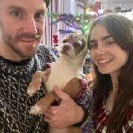 Lily Collins Instagram - The process of getting our holiday photo involves lots of @redforddog kisses (plus a cute cozy sweater) and we’re not complaining. Merry Christmas, everyone! From our lil family to yours…