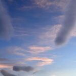 Louise Brealey Instagram - We drove west along the north coast of Scotland into the dazzle of a sunset and made it to the beach just before the sun slipped down behind a band of cloud. There was a smushed marigold on the tide line. I walked the quarter mile to our bit of the beach, where a scree of giant pebbles meet the sand. On my phone is a picture of mum sat here with a towel on her head. I put the marigold on the rocks. The Mexicans call it the flower of the dead and use its bright colours to guide the spirits of their lost ones to their shrines on the Dio de los Muertos. I ran my fingers through the fine white sand and let the sea and the sky do their thing.
