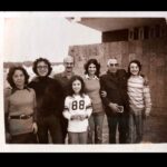 Maria Hinojosa Instagram – This foto right here is my life. Mi vida. Tampico. 1970s. Mi abuelito. My gorgeous parents. My fly sister. My cool bros. And me. I think I was trying to fit in with American kids by trying to like sports. I think this is a hockey jersey. Well, because I lived in Chicago then. Hockey, of course. My cousins from Mexico sent this last night in our chat abt our Tampico memories when about 20 of us would gather for summer or Christmas celebrations and I just wanted to share. This is the real me. 🇲🇽