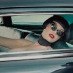 Miriam Veil Instagram - Imaginary Girl 💄👠 Collab with @corsetorium @paulartemis3 ✨ Artwork on wheels @romanceofrust 🖤 #vintagecar #retroglam #davidlynch #corsetry #bobhaircut London, United Kingdom