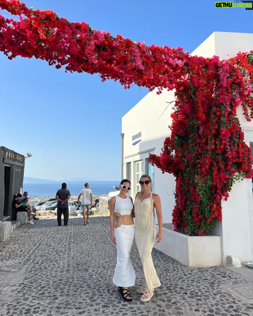 Natalie Negrotti Instagram - First time in Oia Santorini and I’m blown away by it’s beauty. My feet got so swollen I had to wear my pink shower chanclas to sight see before I bought matching Greek made sandals with my prima since my sneakers didn’t fit me! 😂 we rented a convertible red Fiat 🚗 and drove around exploring Santorini, Greece Oia, Santorini