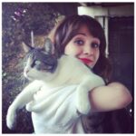 Noël Wells Instagram – just wanna get this out while I have my wits about me, but sadly today me and flinty had to put Mr. Feeny to sleep. To those who knew him, you know this is an end of a freaking era and I’m absolutely beside myself with sadness. 17 years. He was a cool fucking cat, who traversed many college adventures, apartments, houses, boyfriends, and eventually traveled 2000 miles to Los Angeles California where he settled underneath the Hollywood sign, calling Beachwood Canyon home. 

He was a soulmate and companion through many episodes of my youthful immaturity, but was very much loved and quite an honored and illustrious feline who would take walks around the neighborhood and played fetch. He made many brushes with death, but many more brushes with notoriety, landing himself in a viral zine (How to Talk To Your Cat About Gun Safety) being featured in a a published book (Cat Lady, curated by Leah Goren) and of course, he was the inspiration and basis for my first feature film “Mr. Roosevelt.” 

We were lucky to be there with him in his final moments, and he was in my arms with his pretty white paws resting on my wrists like he used to when he was a lil one. 

Thank you so much Flint for being a good cat dad, and thank you Dave for everything. Thanks to all my friends who knew and got him. For just a fucking cat he was one of the very greats.
