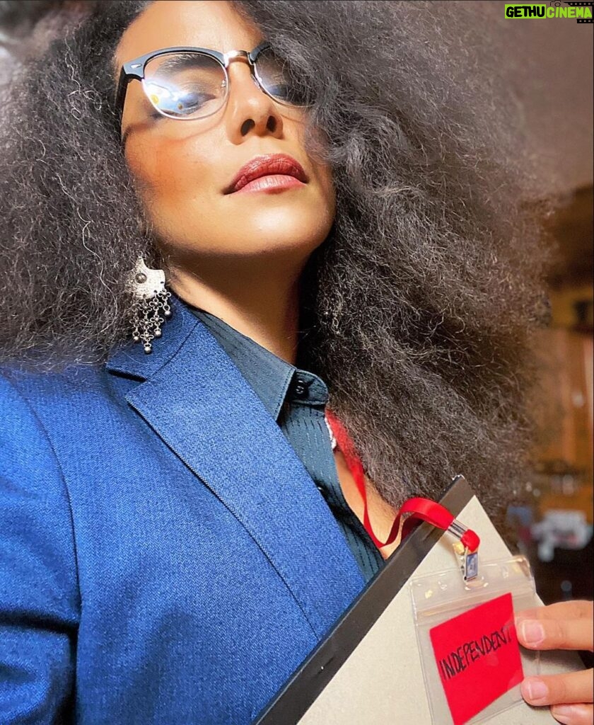 Parisa Fitz-Henley Instagram - Why choose one? Trent Crimm: The Independent Woman Jackie Collins. Happy Halloween, yall! 🎃😈🤓 Image Description: 1. Me with big gray-streaked frizzy hair, Trent Crimm glasses, Jackie Collins makeup, gray jacket and black button-down either of them could wear, silver dangling earrings, red lanyard that reads “Independent”, a notebook and pen. 2. Trent Crimm (of The Independen and Ted Lasso fame) in glasses, blazer, button down and tie. His face framed by luscious gray hair. 3. Jackie Collins, novelist extraordinaire, big frizzy delicious 80’s hair, loads of dramatic 80’s makeup, leopard print blazer/choker/earrings, staring down the camera like she’s about to pounce. 4. Me continuing to feel myself but this time with a bit of a pearl and diamond(ish) choker peeking out at my neckline)