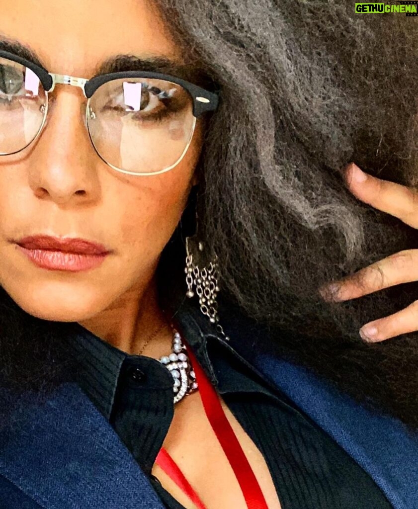 Parisa Fitz-Henley Instagram - Why choose one? Trent Crimm: The Independent Woman Jackie Collins. Happy Halloween, yall! 🎃😈🤓 Image Description: 1. Me with big gray-streaked frizzy hair, Trent Crimm glasses, Jackie Collins makeup, gray jacket and black button-down either of them could wear, silver dangling earrings, red lanyard that reads “Independent”, a notebook and pen. 2. Trent Crimm (of The Independen and Ted Lasso fame) in glasses, blazer, button down and tie. His face framed by luscious gray hair. 3. Jackie Collins, novelist extraordinaire, big frizzy delicious 80’s hair, loads of dramatic 80’s makeup, leopard print blazer/choker/earrings, staring down the camera like she’s about to pounce. 4. Me continuing to feel myself but this time with a bit of a pearl and diamond(ish) choker peeking out at my neckline)