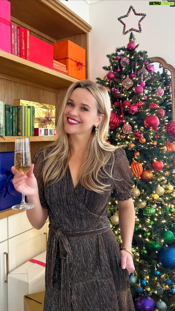 Reese Witherspoon Instagram - Bringing that holiday magic 🥂 (and serving up gift guides) 🎁 Link in bio for more!