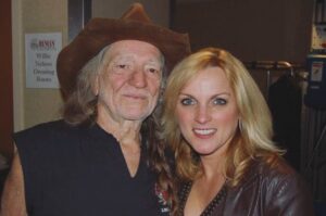 Rhonda Vincent Instagram - 14 years ago today - Friday, November 6, 2009 - The day I met #WillieNelson  @willienelsonofficial when we opened a show for him @theryman  With great anticipation, we took the stage. The house lights were up and never dimmed as we started the set with our bluegrass “Song of the Year” - Kentucky Borderline.  People were milling about, barely applauding, and barely listening. Since we don’t use a set list, it became a challenge to find the right song that the audience might react to. We played another song of the year - Is The Grass Any Bluer on the Other Side.  Still no response, so I decided on one of the fastest songs we do, sang by Mickey Harris - Lost All My Money But A Two Dollar Bill”. That was the magic song that turned things around. They immediately started listening and the response was amazing. They were intently listening, so now the new challenge would be how they would react to an accapella gospel song “Fishers of Men”. It worked!! Standing ovation at the Ryman. Sometimes you just gotta find the right song. I was honored to record with Willie on two of my albums. His line on the Christmas project “Eleven pipers piping” on the Twelve Days of Christmas is the BEST!  He also sang a duet with me on the song “Only Me”, singing and playing guitar!! Willie — you are amazing and I’m honored to have these opportunities.  Thank you!!