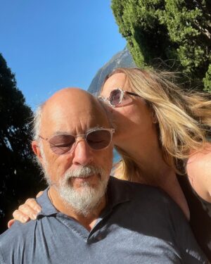 Sheila Kelley Instagram - How do you love each other? I just held a workshop on how to amplify your masculine and feminine energy to love deeper. There were 3,000 people on the @mindvalley zoom call. It was so beautiful to watch the chat fly by with humanity, love, respect, and intrigue. What touched me the most were the comments asking for more clarification about love. About being seen in a world that is full of “too much”. Too much input, too much advice, too much direction, too much angst, too much desperation. It’s simple really: Love lives in the quiet moments of connection between you and your beloved. And when I say “your beloved” I am referring to any person with whom you share any kind of love. It could be the love between friends or the love between lovers. But the knowing connection in eye to eye contact - that moment where you spend an extra two seconds looking into each other’s souls, that moment is sizzling, and heart opening and soul inspiring. Try it today. Maintain eye to eye connection with someone and feel your entire being elevate for just that moment. But know the impact will ripple throughout your life. 
⠀⠀⠀⠀⠀⠀⠀⠀⠀
For us it’s a New year, deeper love. ❤️❤️❤️ 
⠀⠀⠀⠀⠀⠀⠀⠀⠀
If you want to know more about how we love and have loved for 34 years? Comment with a kiss below… 💋 And ask me anything you’d like!