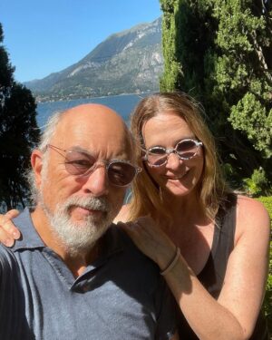 Sheila Kelley Instagram - How do you love each other? I just held a workshop on how to amplify your masculine and feminine energy to love deeper. There were 3,000 people on the @mindvalley zoom call. It was so beautiful to watch the chat fly by with humanity, love, respect, and intrigue. What touched me the most were the comments asking for more clarification about love. About being seen in a world that is full of “too much”. Too much input, too much advice, too much direction, too much angst, too much desperation. It’s simple really: Love lives in the quiet moments of connection between you and your beloved. And when I say “your beloved” I am referring to any person with whom you share any kind of love. It could be the love between friends or the love between lovers. But the knowing connection in eye to eye contact - that moment where you spend an extra two seconds looking into each other’s souls, that moment is sizzling, and heart opening and soul inspiring. Try it today. Maintain eye to eye connection with someone and feel your entire being elevate for just that moment. But know the impact will ripple throughout your life. 
⠀⠀⠀⠀⠀⠀⠀⠀⠀
For us it’s a New year, deeper love. ❤️❤️❤️ 
⠀⠀⠀⠀⠀⠀⠀⠀⠀
If you want to know more about how we love and have loved for 34 years? Comment with a kiss below… 💋 And ask me anything you’d like!