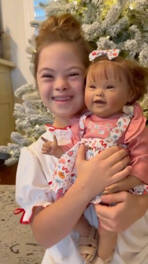 Sofia Sanchez Instagram - Christmas came with a little “extra” magic this year! The most beautiful baby doll with a little something extra. Her name is GiGi and she’s PRECIOUS! 

Thank you @paradisegalleries for creating a baby doll that captures the rare beauty of Down syndrome. We will cherish her!
#nevertooold #underneaththetree #downsyndromeawareness