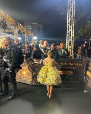 Sofia Sanchez Instagram - World Premiere in Berlin for @thehungergames The Ballad of Songbirds & Snakes 🕊️🐍

I had the time of my life meeting fans, signing autographs and watching the movie for the very first time! It is the most amazing film and I’m so proud! My dress is an homage to the working title of the film “Butterfly” as well as a nod to the butterfly symbol for Down syndrome awareness and my debut as an actress on the big screen. The colors yellow and blue are the colors of DS Awareness and my home country Ukraine. Truly a work of art by the amazing #houseofpetunia 

It was a night I will never forget! #corememory 

Custom Dress & Styling: @dolorispetunia 🦋
Hair & Makeup: @thesanchezsix 💫