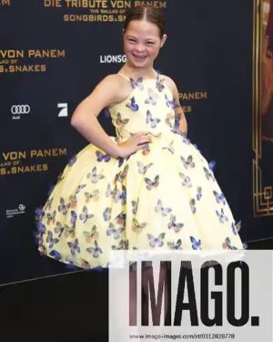 Sofia Sanchez Instagram - World Premiere in Berlin for @thehungergames The Ballad of Songbirds & Snakes 🕊️🐍

I had the time of my life meeting fans, signing autographs and watching the movie for the very first time! It is the most amazing film and I’m so proud! My dress is an homage to the working title of the film “Butterfly” as well as a nod to the butterfly symbol for Down syndrome awareness and my debut as an actress on the big screen. The colors yellow and blue are the colors of DS Awareness and my home country Ukraine. Truly a work of art by the amazing #houseofpetunia 

It was a night I will never forget! #corememory 

Custom Dress & Styling: @dolorispetunia 🦋
Hair & Makeup: @thesanchezsix 💫
