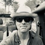 Walton Goggins Instagram – See that smile…  I feel like I ate the canary. Just drove back from NYC. Got caught in a rainstorm. Pulled under a bridge. Left when it abated then drove straight into a bigger storm only this time there was no bridge. I got soaked, The car got soaked… everything got soaked. Listening to John Lennon the whole time. Didn’t even have to use a rag… the wind dried it. Now I’m on my dirt road. What a day this has been. Summer Upstate. Every day is something different. Gratitude I tell ya.