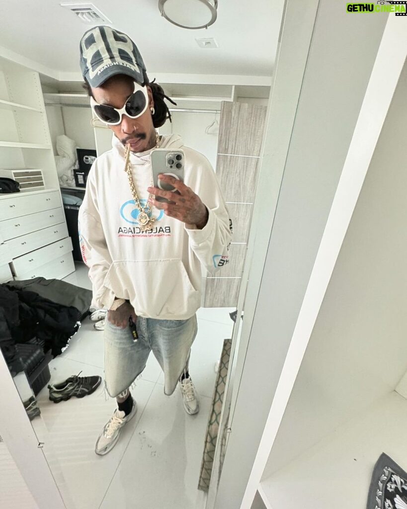Wiz Khalifa Instagram - Left the strip club wit ones in my balenci hood