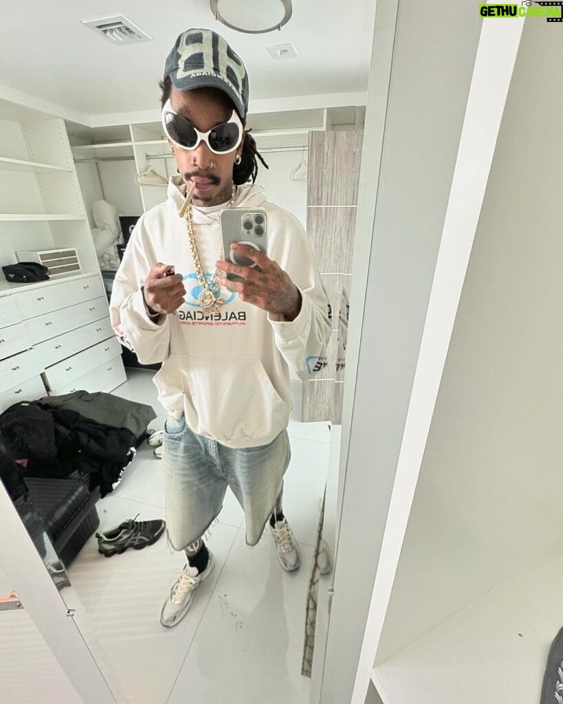 Wiz Khalifa Instagram - Left the strip club wit ones in my balenci hood
