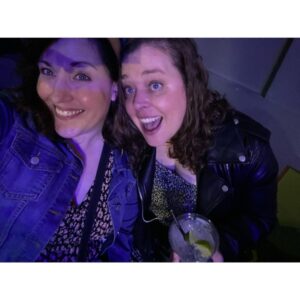Allison Tolman Instagram - We’re doing it we did it we’re together we’re out! 

*edit for clarification because I’m an idiot: This is my college friend Kate who is visiting from St. Louis. We haven’t seen each other in years. We finally hauled ourselves off the couch and out into public to see @ttfapodcast live. I wrote this caption super fast before turning my phone off for the show. I didn’t mean to accidentally come out on National Coming Out Day, and I can’t wait to tell this story on a podcast. Jesus fuck. 🤦🏻‍♀️ 

** I can promise you if I ever come out in an Instagram post it will be with professionally shot thirst trap photos of me and the super hot masc lesbian or enby of my dreams who has finally rescued me from a lifetime of dating men. ❤️