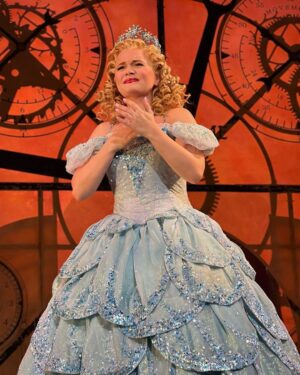 Amanda Jane Cooper Instagram - “Fellow Ozians. Friends... We have been through a frightening time. And there will be other times, and other things that frighten us. But if you’ll let me, I’d like to try -- to help. I’d like to try to be -- Glinda the Good.” 

An honor every time. These photos were taken during bows last night. I’m so grateful.

Here at the Gershwin through September 10th as 🫧bubble back-up🫧…this company has been nothing short of phenomenal to cheer on and to work with. It’s a gift to be back. 

Photos by @ellielucass