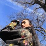 Amanda Zhou Instagram - Happy Lunar New Year!  ———> for more✌️ Vibing in my mama’s coat. Back then, I thought her clothes were too extra for me. Fast forward to now, mom was a fashion genius and I’m rocking it cause you’re never too old for a dress-up game.🌟  . . . #blackcoat #asianfashion #thanksmom #yearofthedragon #yearofthedragon2024 #lunarnewyear2024