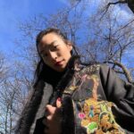 Amanda Zhou Instagram - Happy Lunar New Year!  ———> for more✌️ Vibing in my mama’s coat. Back then, I thought her clothes were too extra for me. Fast forward to now, mom was a fashion genius and I’m rocking it cause you’re never too old for a dress-up game.🌟  . . . #blackcoat #asianfashion #thanksmom #yearofthedragon #yearofthedragon2024 #lunarnewyear2024