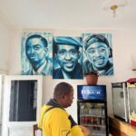 Antonio Dikele Distefano Instagram - Lei è mia madre. Oggi abbiamo finalmente aperto la nostra prima attività insieme in Angola. “Dikele Internet Cafe” è uno spazio ispirato al modello Starbucks dove i ragazzi delle scuole possono studiare, guardare la televisione via cavo e avere accesso a internet di fronte ad un succo e i dolci tipici angolani. Non so se si capisce dalla foto ma mamma è molto felice. Luanda, Angola