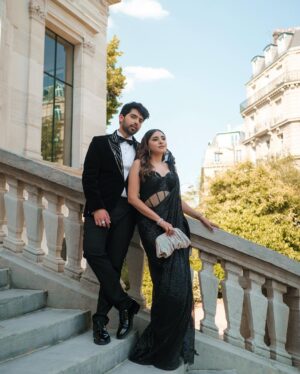Armaan Malik Instagram - with my 🖤 in Paris, for @gauravguptaofficial @ggpanther at haute couture week

Both wearing @gauravguptaofficial
Armaan’s jewellery @dripproject.co 
Aashna’s jewellery @prerto @karishma.joolry 
Styled by @malvika_tater

Photos by @harvijay_j