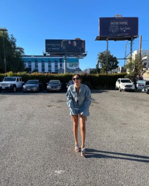 Ashley Nicole Williams Instagram - so I ironically wore the same jean outfit 2 1/2 years ago in front of our first billboard as I did in front of our last. and boy has baby grown. if I could hug that girl and hold her tight, say ya did it kid. 3 seasons as a lead on a tv show. I’m so proud of you. proud of us. cheers to these final episodes, cheers to 4 years of making this show and 3 wildly beautiful seasons, and cheers to leaving a mark on anyone and everyone who loves our show as much as we do. This final season is and always will be for you guys. See u tonight for episode 6. Goddess protect. 🤍 AB